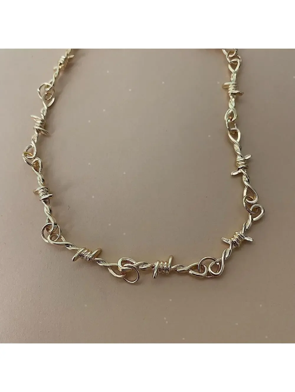 Y2k gold barbwire opium punk style chocker necklace. Cool design. Nice quality.